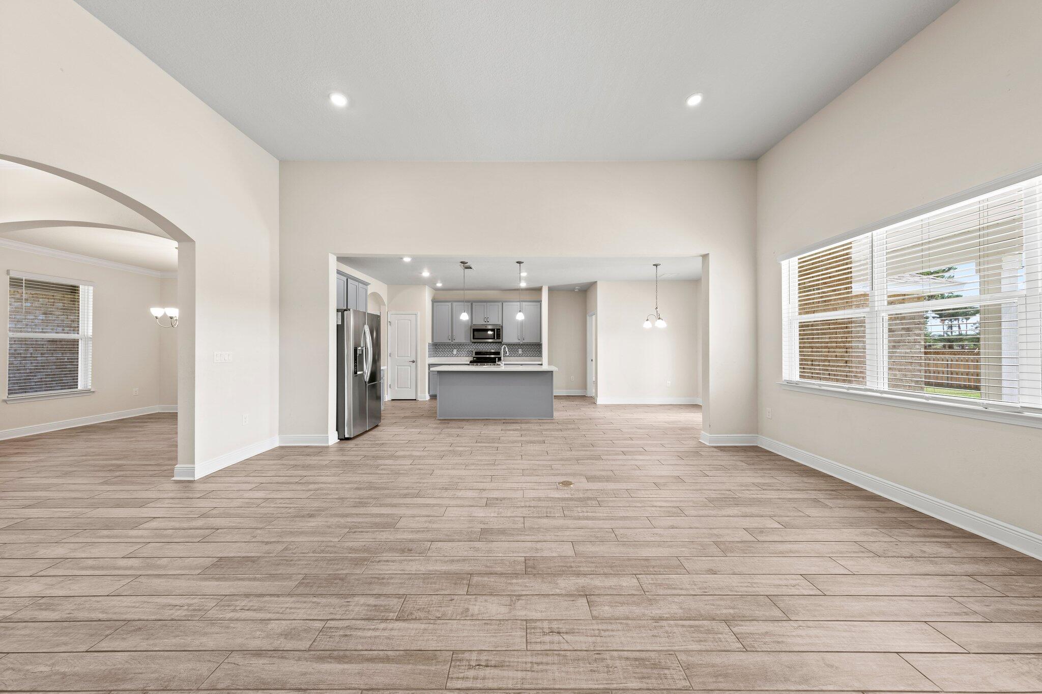 91 Sweet Tea Lane Freeport, FL 32439 - Photo 26 of 80 a view of empty room with kitchen and window