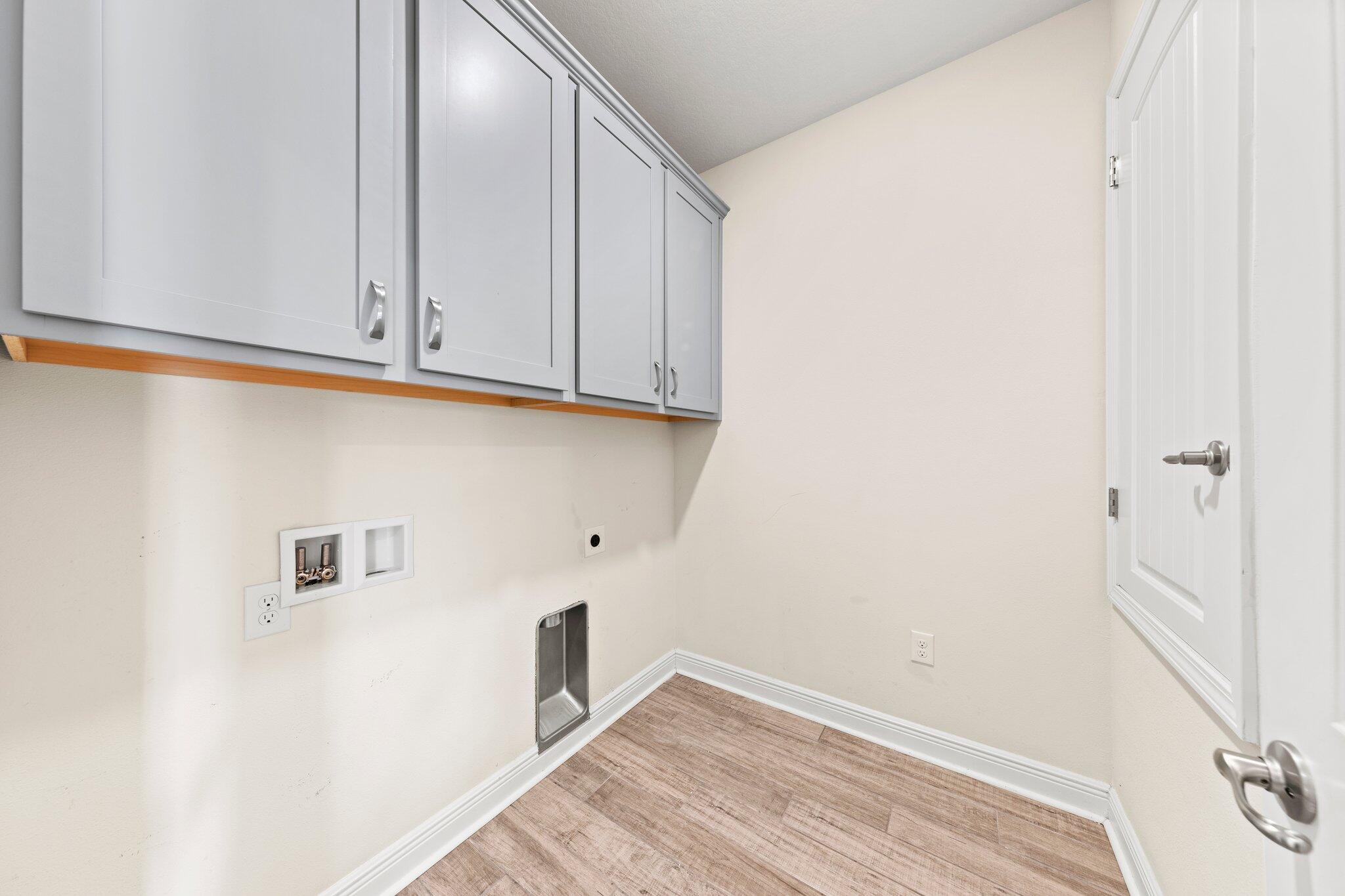 91 Sweet Tea Lane Freeport, FL 32439 - Photo 43 of 80 a view of storage and utility room with wooden floor