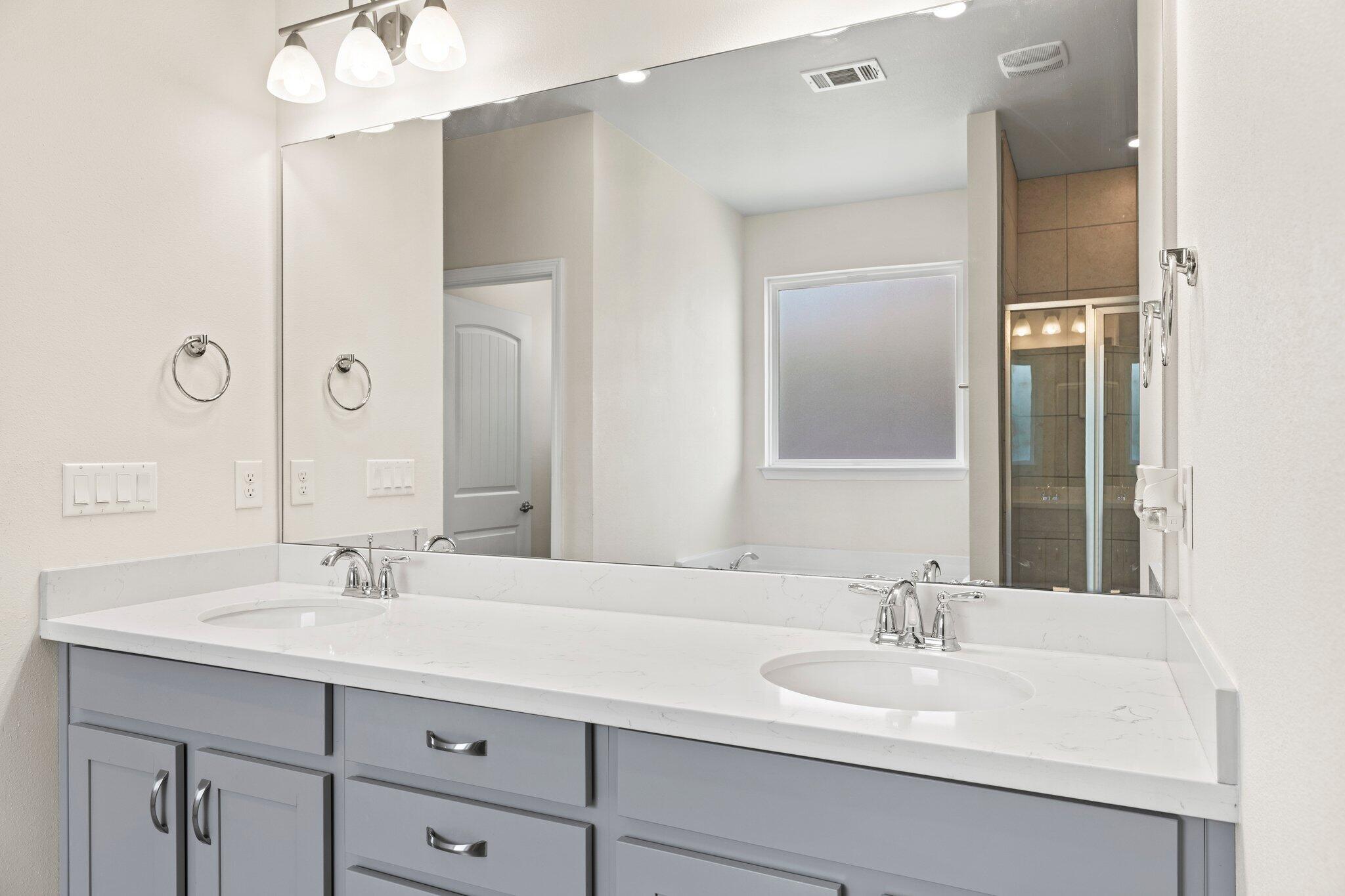 91 Sweet Tea Lane Freeport, FL 32439 - Photo 49 of 80 a bathroom with a sink vanity and a mirror