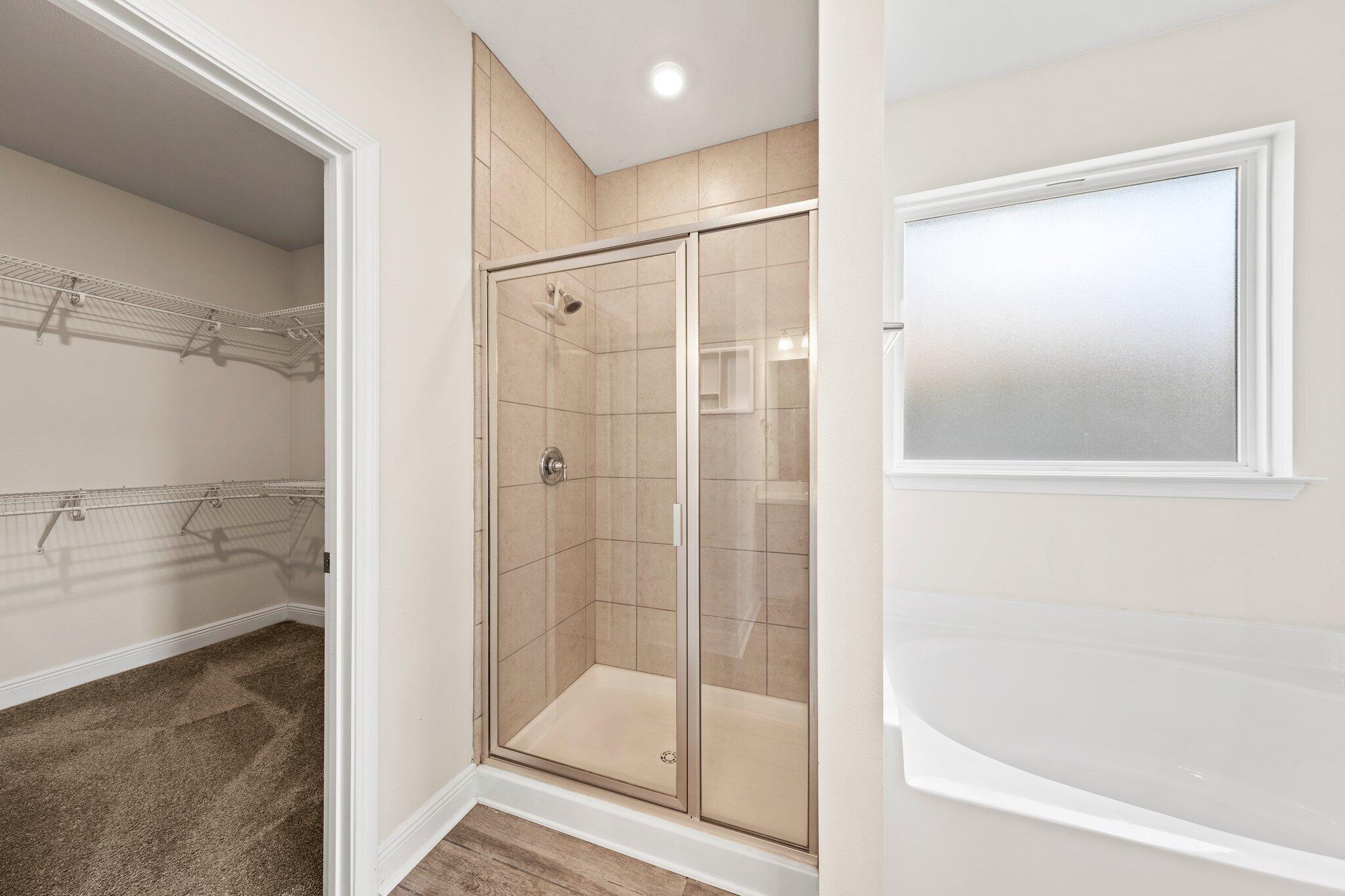 91 Sweet Tea Lane Freeport, FL 32439 - Photo 53 of 80 a bathroom with a shower and a bath tub