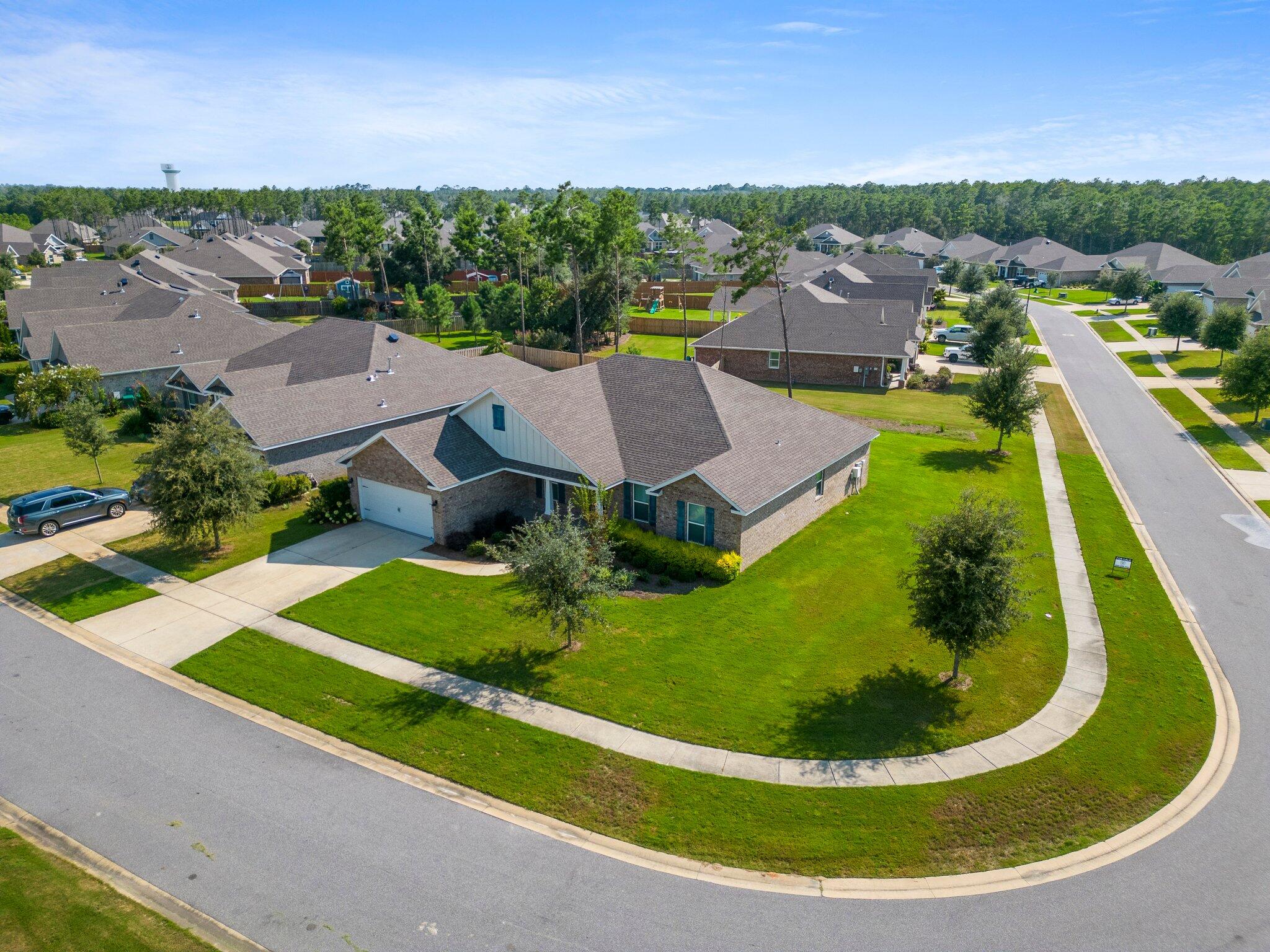 91 Sweet Tea Lane Freeport, FL 32439 - Photo 6 of 80 an aerial view of residential houses with outdoor space and trees