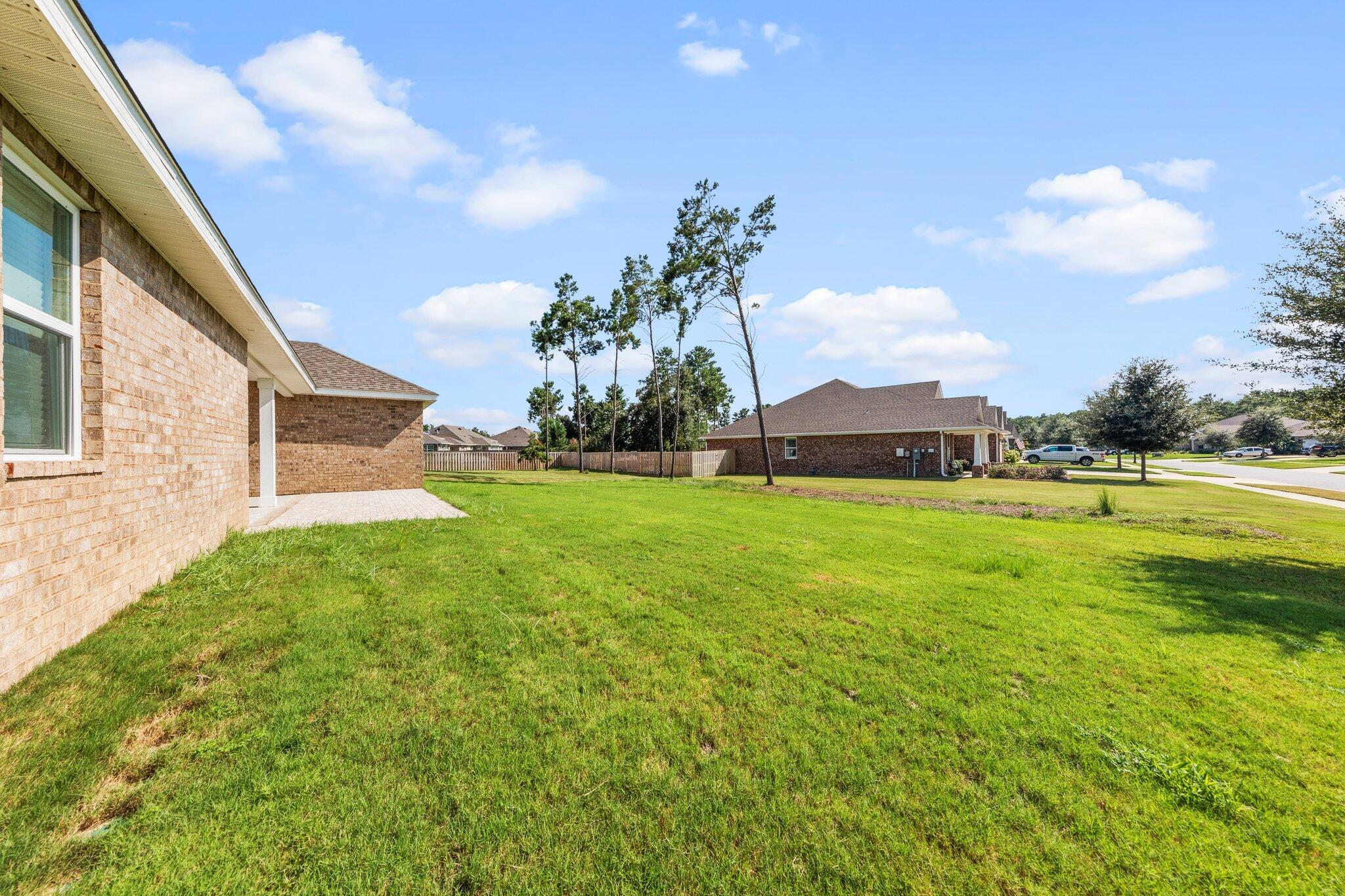 91 Sweet Tea Lane Freeport, FL 32439 - Photo 67 of 80 a view of green field with house in the background