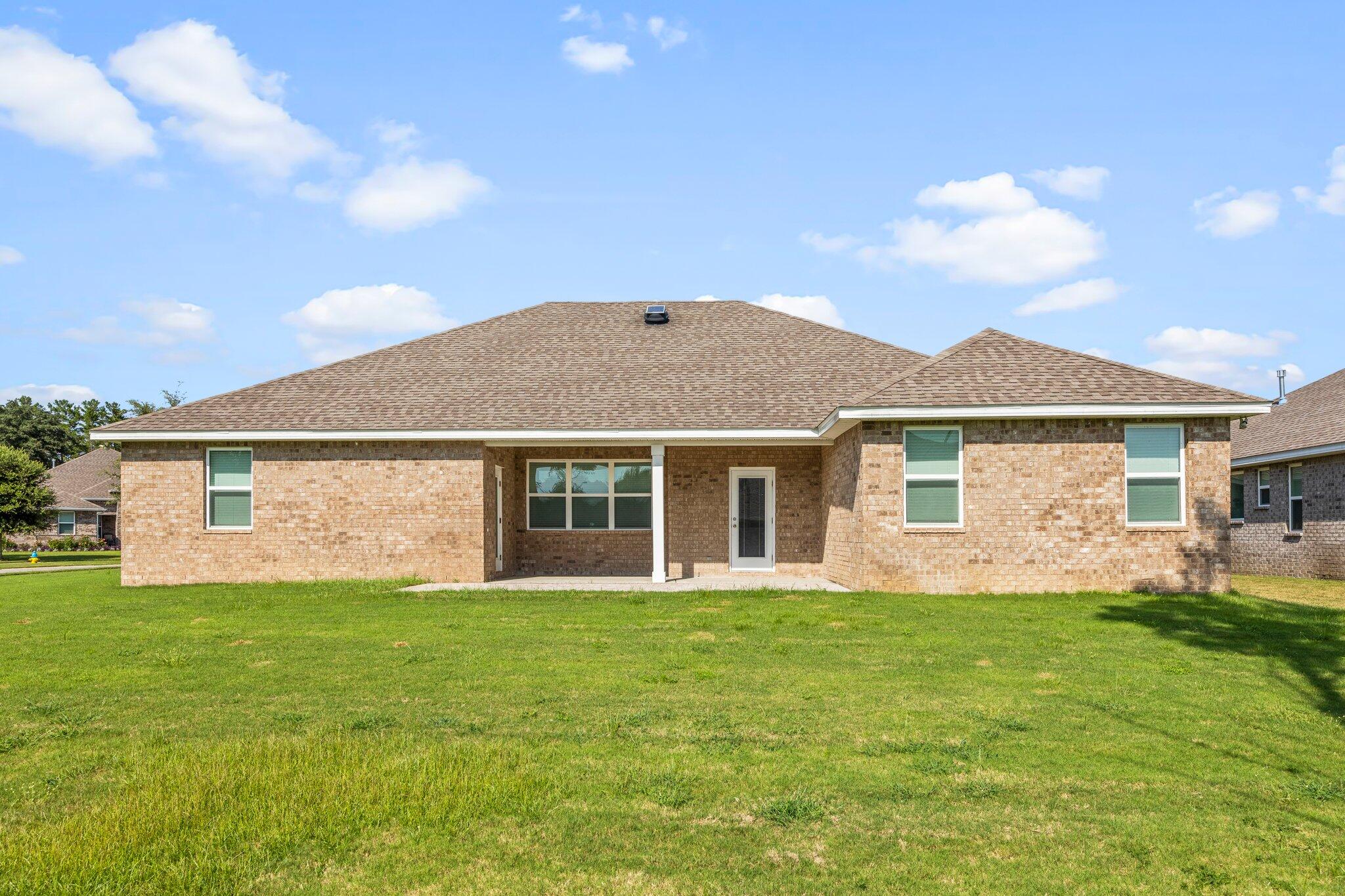 91 Sweet Tea Lane Freeport, FL 32439 - Photo 69 of 80 a front view of house with yard and green space