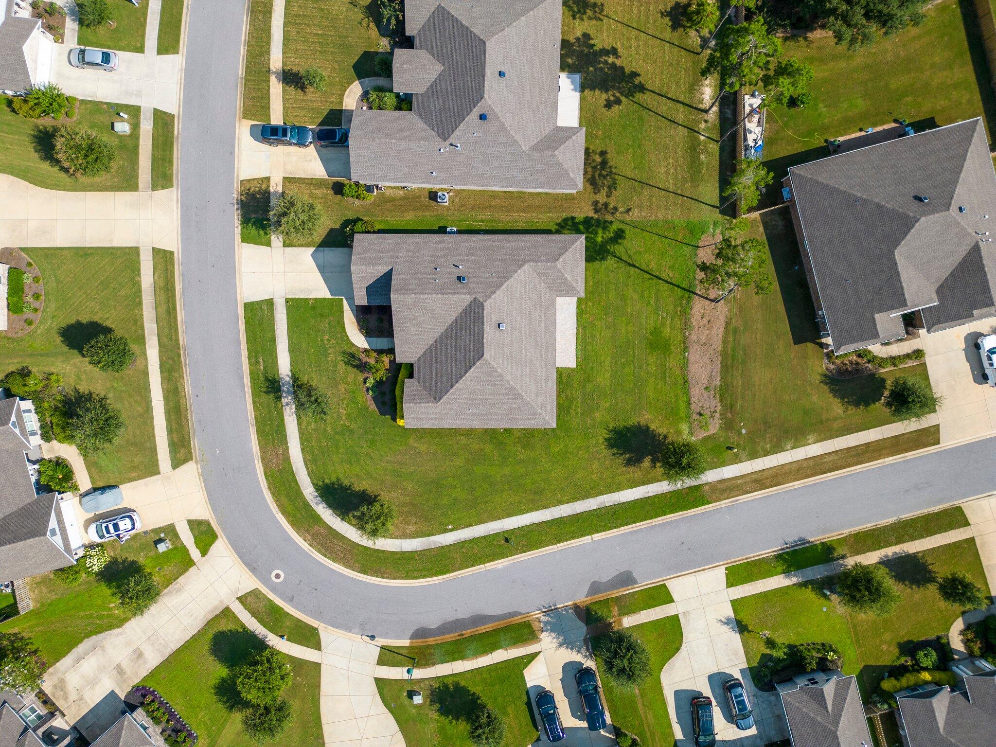 91 Sweet Tea Lane Freeport, FL 32439 - Photo 7 of 80 an aerial view of a residential houses with outdoor space and a car park