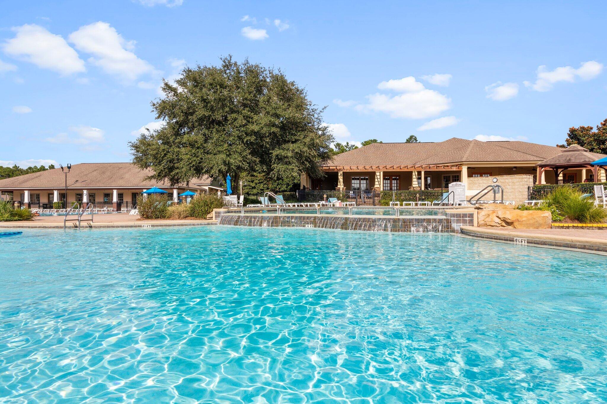 91 Sweet Tea Lane Freeport, FL 32439 - Photo 76 of 80 a front view of a house with a yard table and chairs