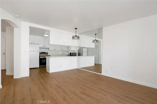 a view of a kitchen with wooden floor