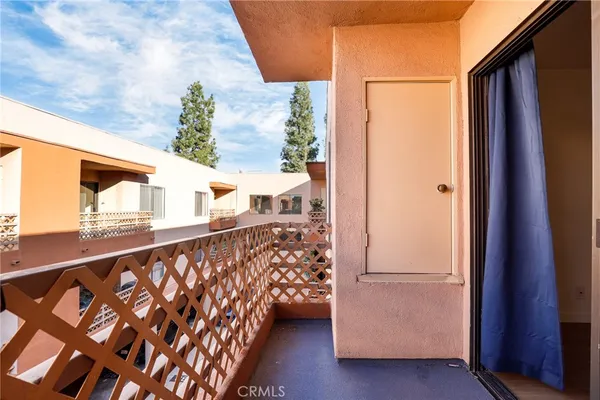 a view of balcony with wooden floor