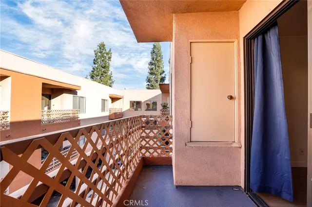 a view of balcony with wooden floor