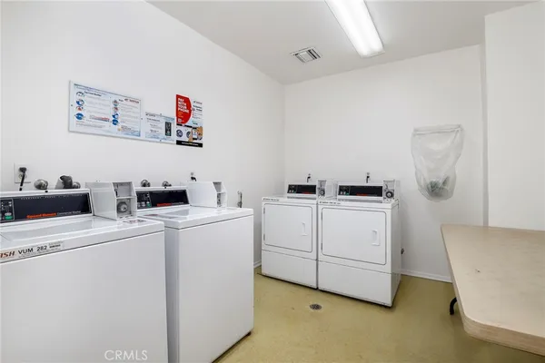 a view of kitchen and refrigerator