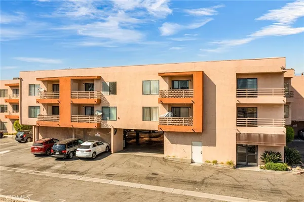 a view of a car park in front of a building