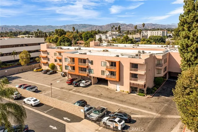 a view of a swimming pool with a yard and plants