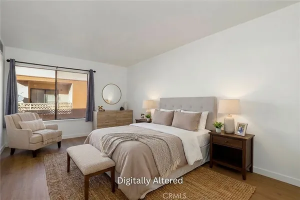 a bedroom with a bed and a couch
