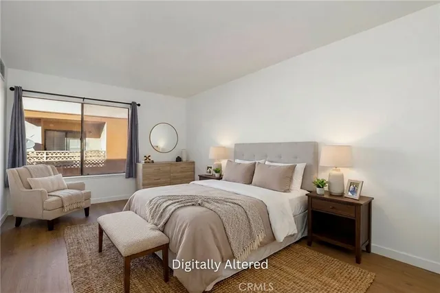 a bedroom with a bed and a couch