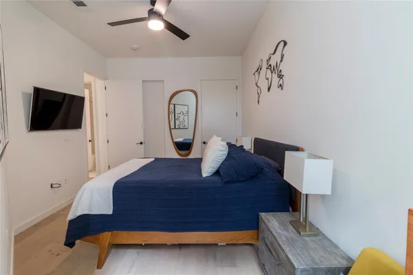 a bed room with a bed and a couch