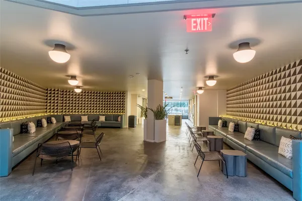 a reading room with furniture and wooden floor