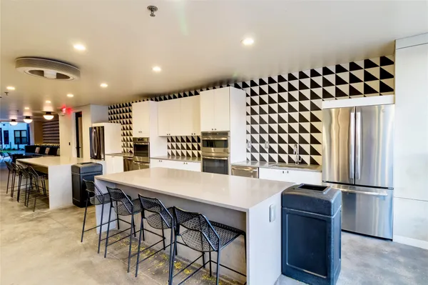 a kitchen with a table and chairs