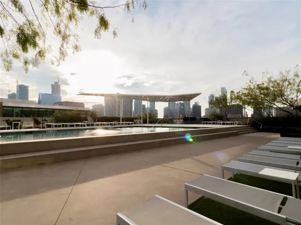 a view of swimming pool with outdoor seating