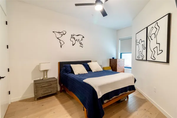 a kitchen with stainless steel appliances a refrigerator a stove a sink a dining table and chairs