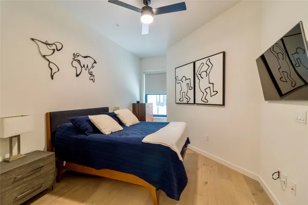 a bedroom with a bed and a table