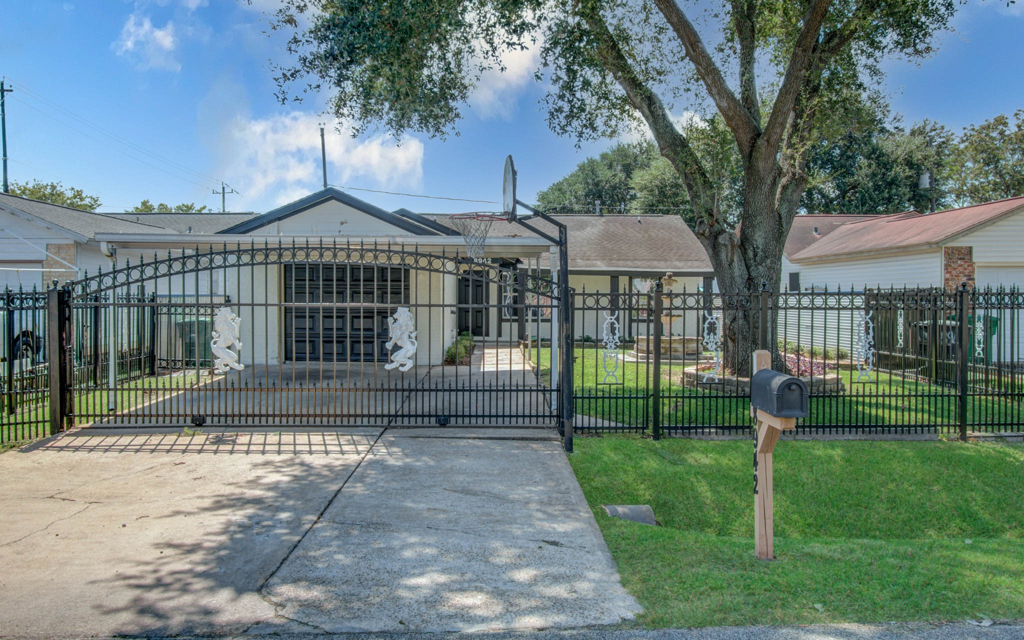 8942 Judwin Street Houston, TX 77075 - Photo 1 of 21 a view of an house with backyard and a tree