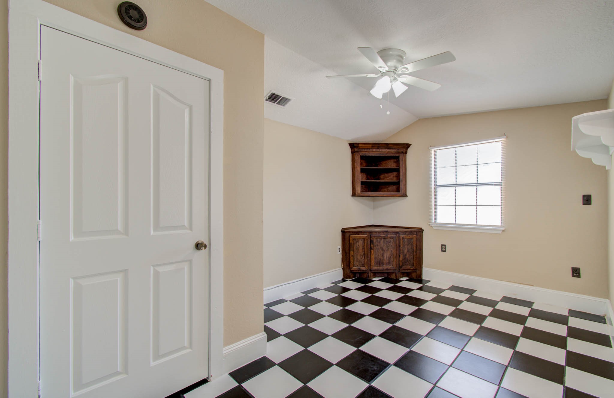 8942 Judwin Street Houston, TX 77075 - Photo 13 of 21 a view of a livingroom with a chandelier fan and windows