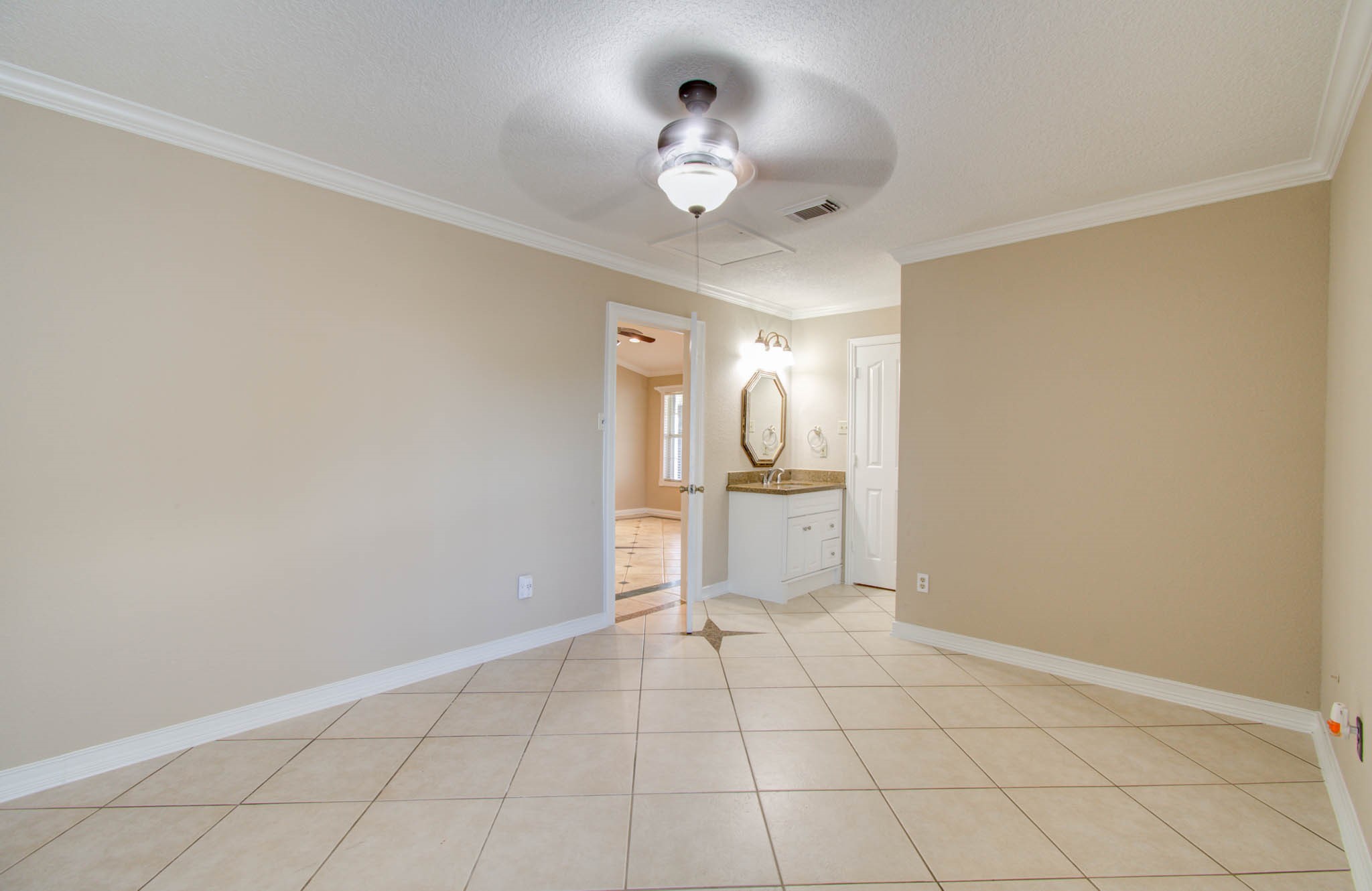 8942 Judwin Street Houston, TX 77075 - Photo 18 of 21 a spacious bathroom with a mirror and a shower