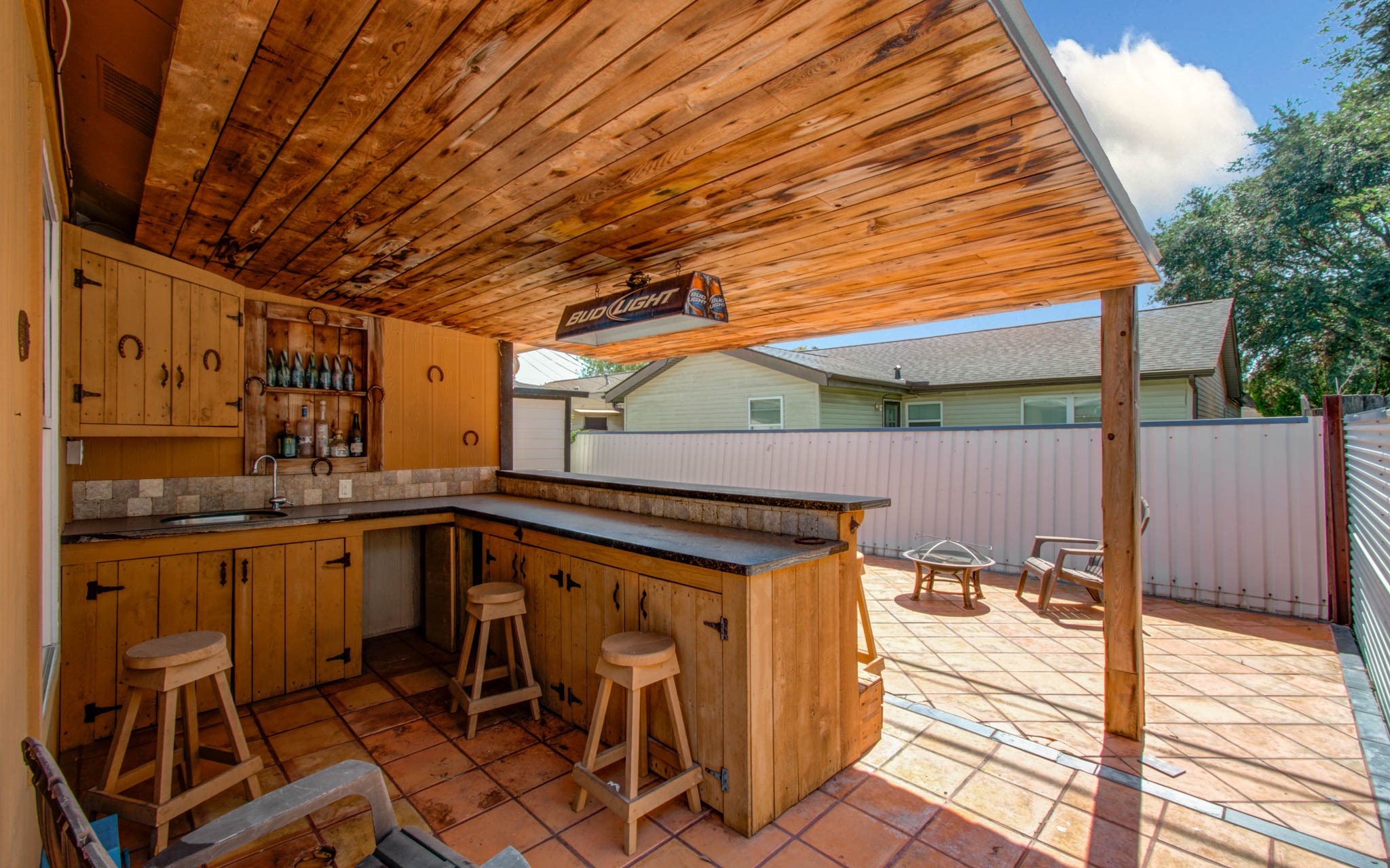 8942 Judwin Street Houston, TX 77075 - Photo 21 of 21 a view of a patio with table and chairs with wooden floor and fence