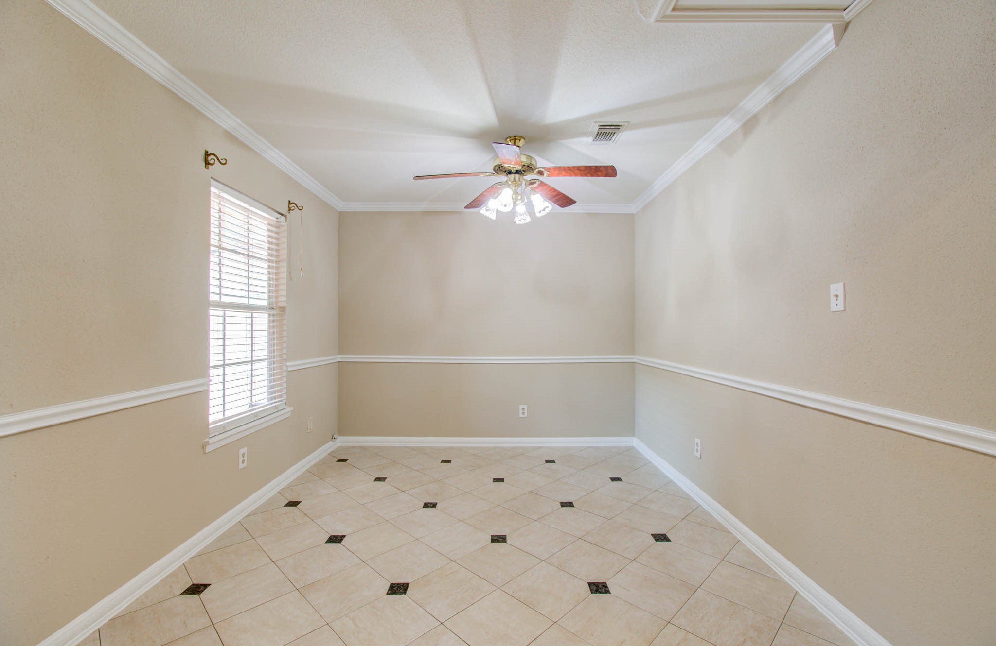 8942 Judwin Street Houston, TX 77075 - Photo 7 of 21 wooden floor in an empty room with a window