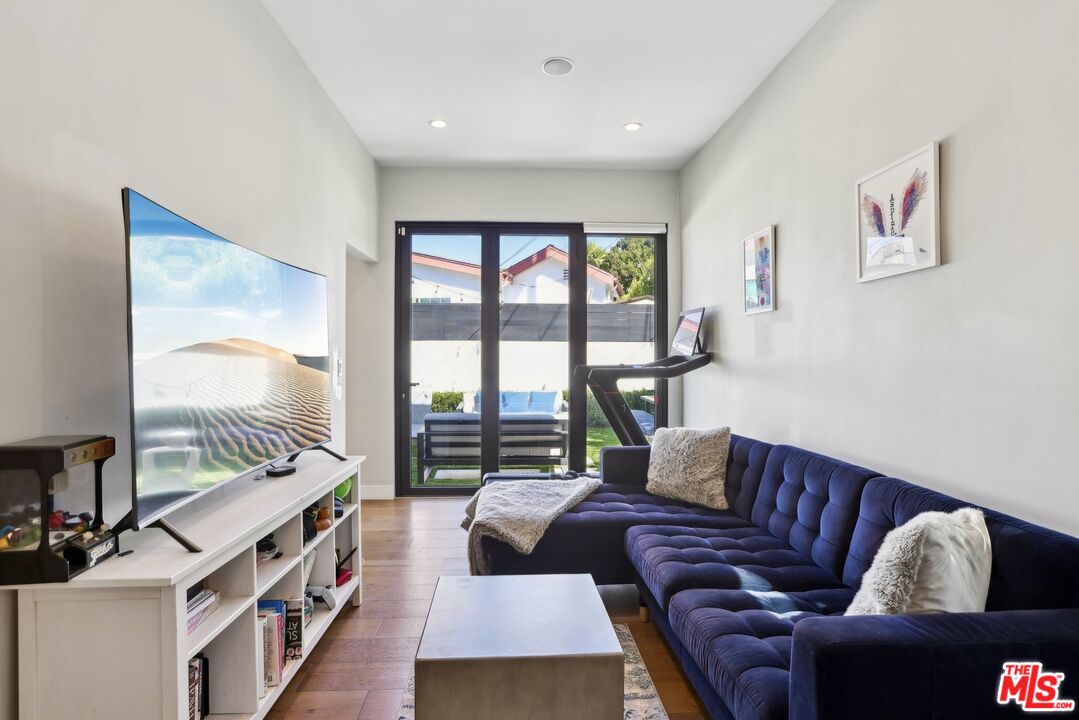 1506 Walgrove Avenue Los Angeles, CA 90066 - Photo 12 of 25 a living room with furniture and a large window