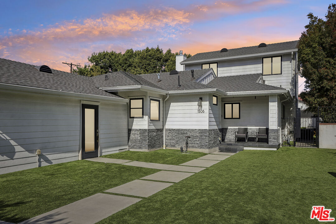 1506 Walgrove Avenue Los Angeles, CA 90066 - Photo 2 of 25 a front view of a house with a yard
