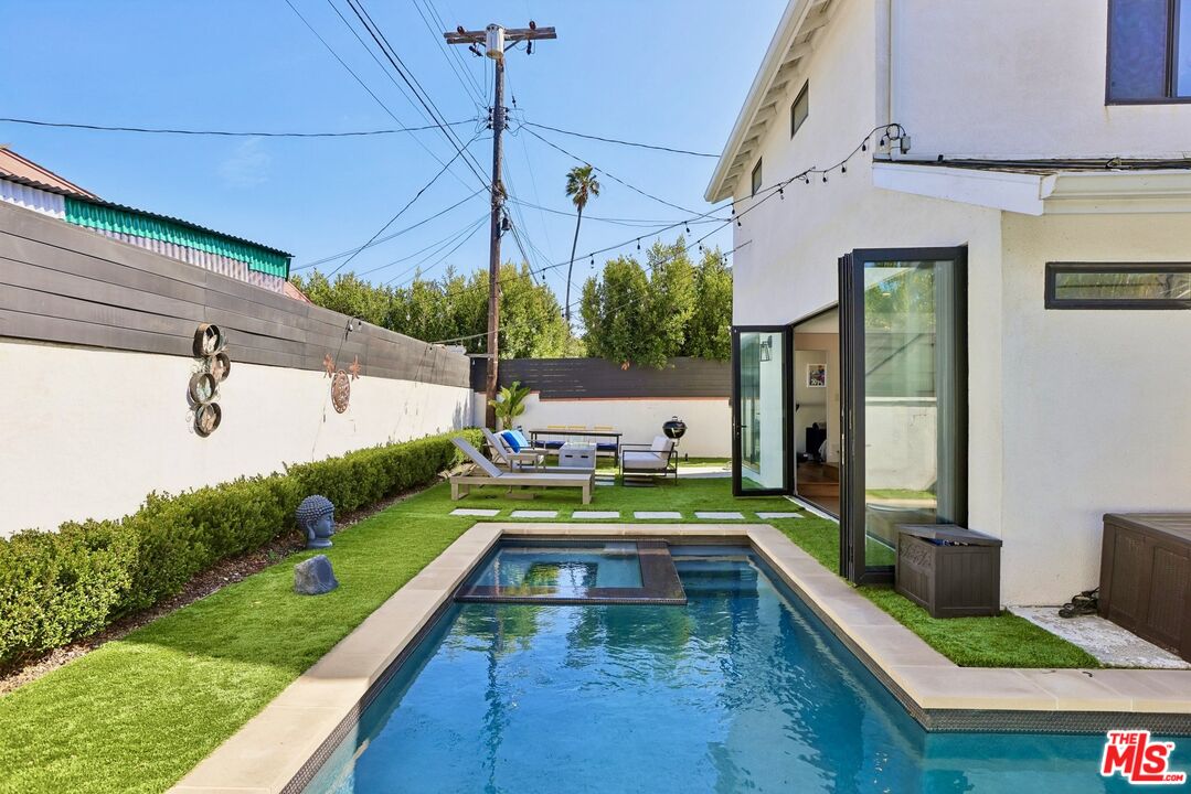 1506 Walgrove Avenue Los Angeles, CA 90066 - Photo 23 of 25 a view of swimming pool with seating area