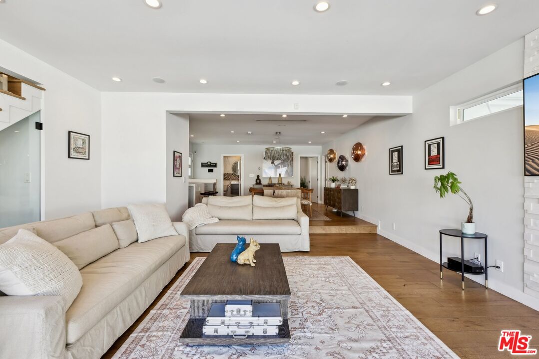 1506 Walgrove Avenue Los Angeles, CA 90066 - Photo 3 of 25 a living room with furniture and wooden floor