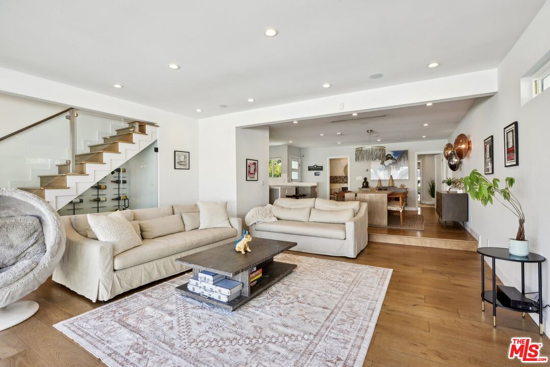 1506 Walgrove Avenue Los Angeles, CA 90066 - Photo 4 of 25 a living room with furniture and a rug