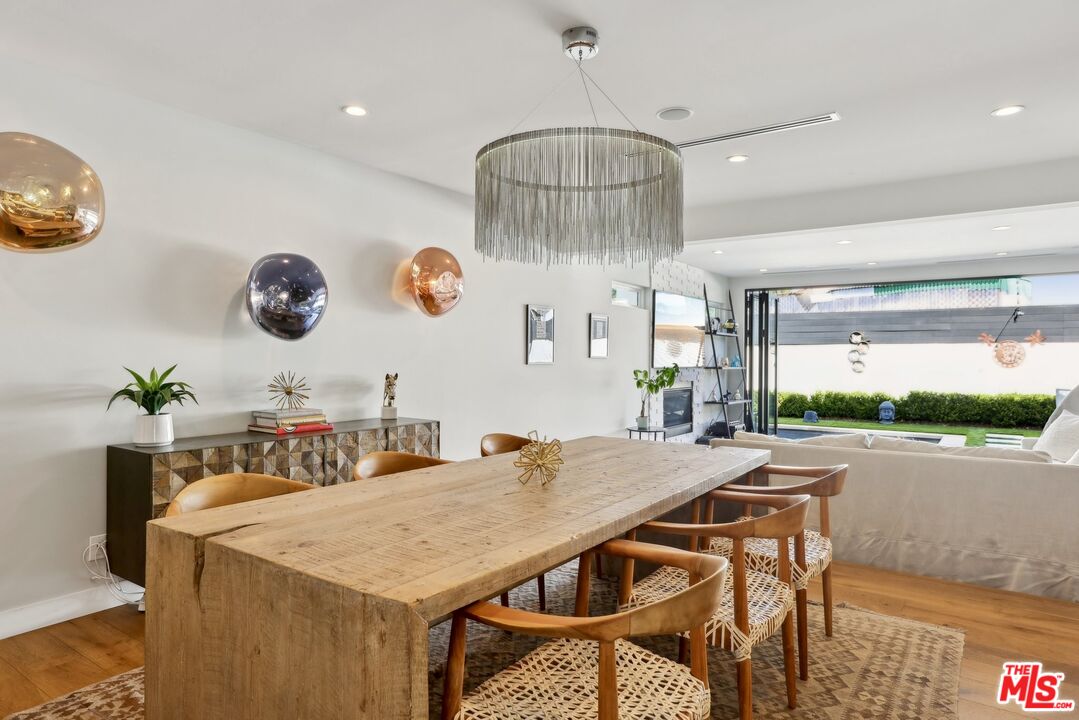 1506 Walgrove Avenue Los Angeles, CA 90066 - Photo 6 of 25 a kitchen with a table and chairs in it