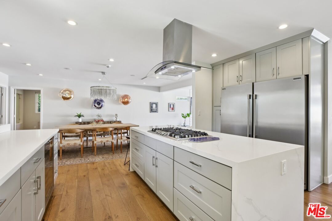 1506 Walgrove Avenue Los Angeles, CA 90066 - Photo 10 of 25 a kitchen with a stove and a refrigerator