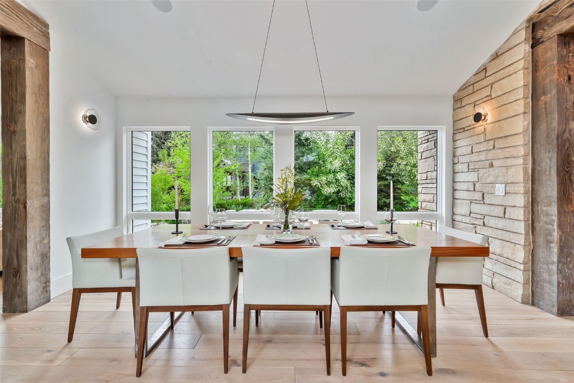 24 Maple Street Steamboat Springs, CO 80487 - Photo 15 of 49 a dining room with furniture a chandelier and a rug