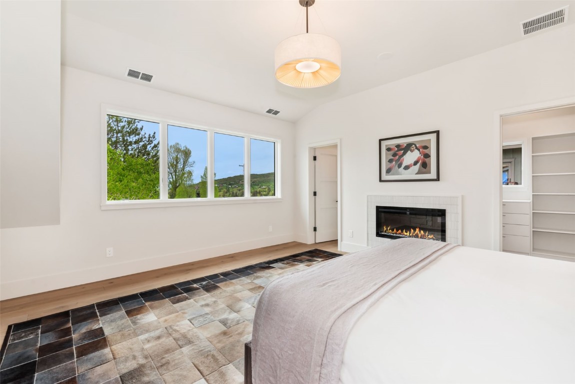 24 Maple Street Steamboat Springs, CO 80487 - Photo 23 of 49 a spacious bedroom with a bed and a window