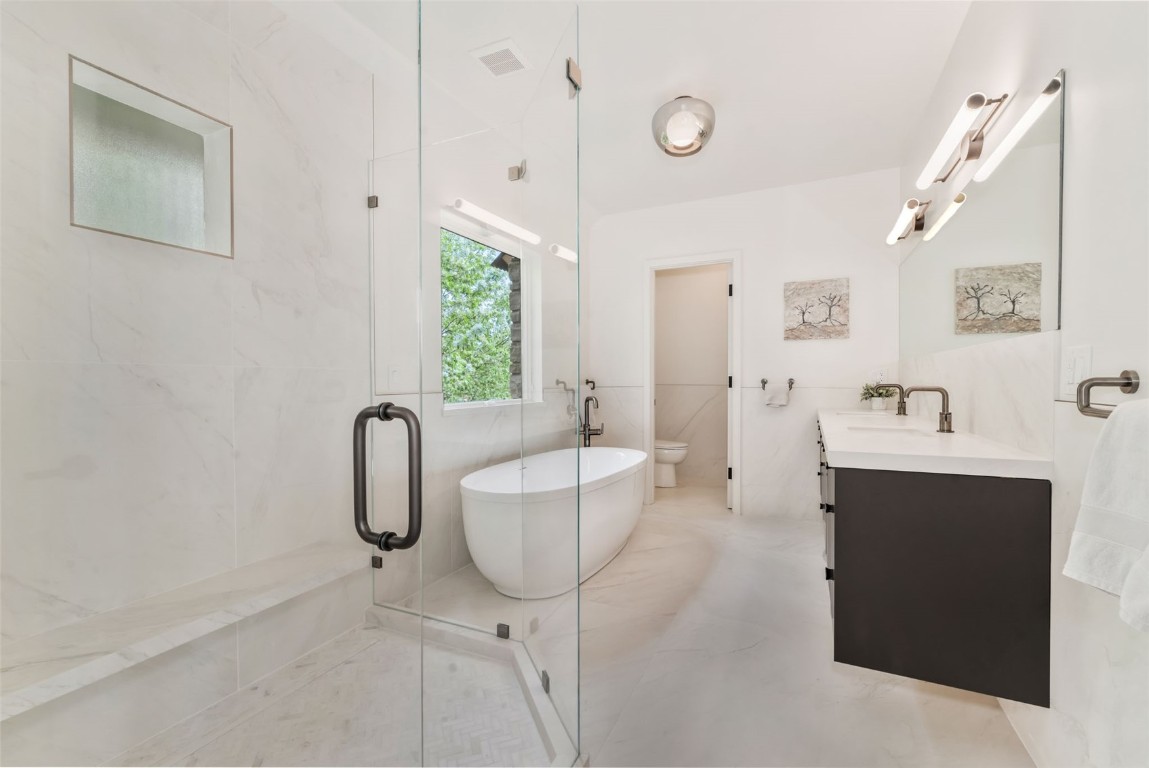 24 Maple Street Steamboat Springs, CO 80487 - Photo 24 of 49 a spacious bathroom with a bathtub sink and mirror