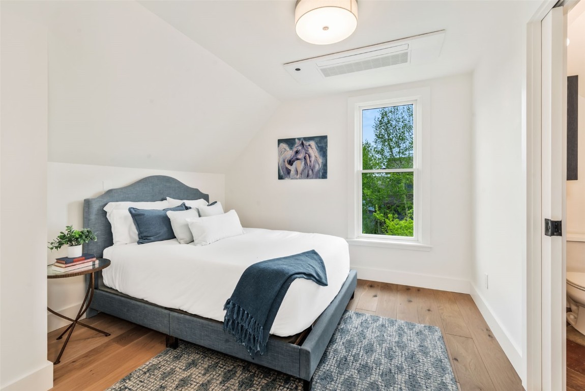 24 Maple Street Steamboat Springs, CO 80487 - Photo 29 of 49 a bedroom with a large bed and a window