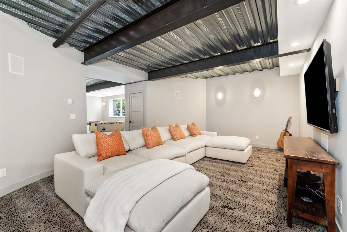 24 Maple Street Steamboat Springs, CO 80487 - Photo 35 of 49 a living room with furniture and a flat screen tv