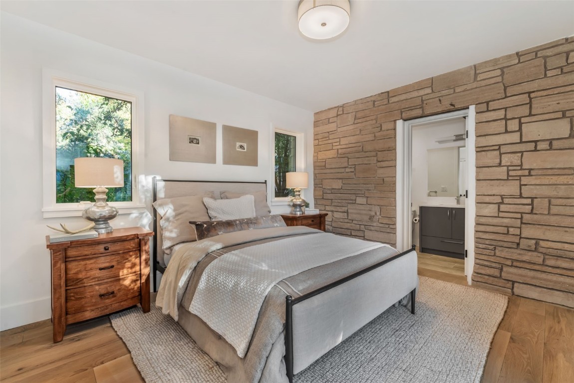 24 Maple Street Steamboat Springs, CO 80487 - Photo 38 of 49 a bedroom with a bed and a flat tv screen on dresser