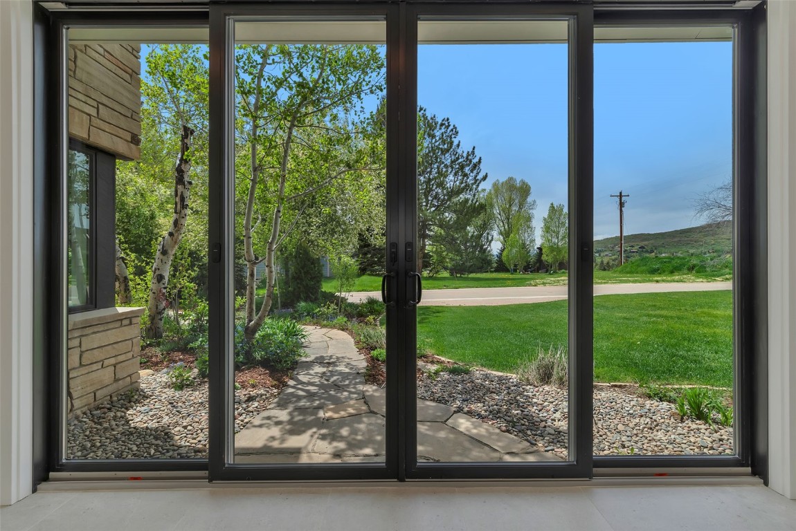 24 Maple Street Steamboat Springs, CO 80487 - Photo 40 of 49 a view of backyard with large trees and plants