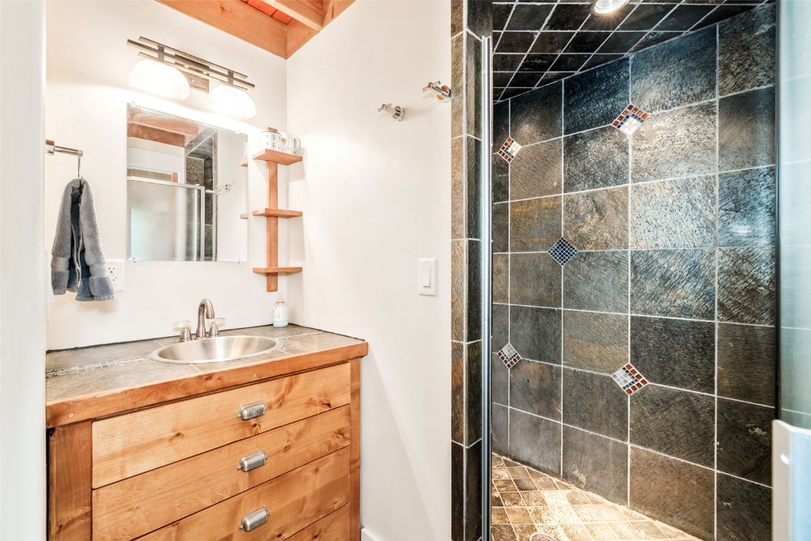 24 Maple Street Steamboat Springs, CO 80487 - Photo 48 of 49 a bathroom with a sink and a mirror