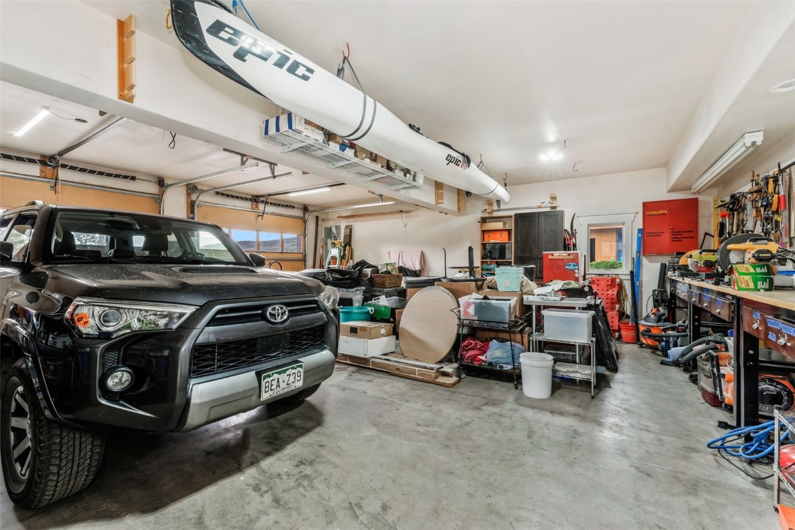 24 Maple Street Steamboat Springs, CO 80487 - Photo 49 of 49 a view of a garage with parked cars