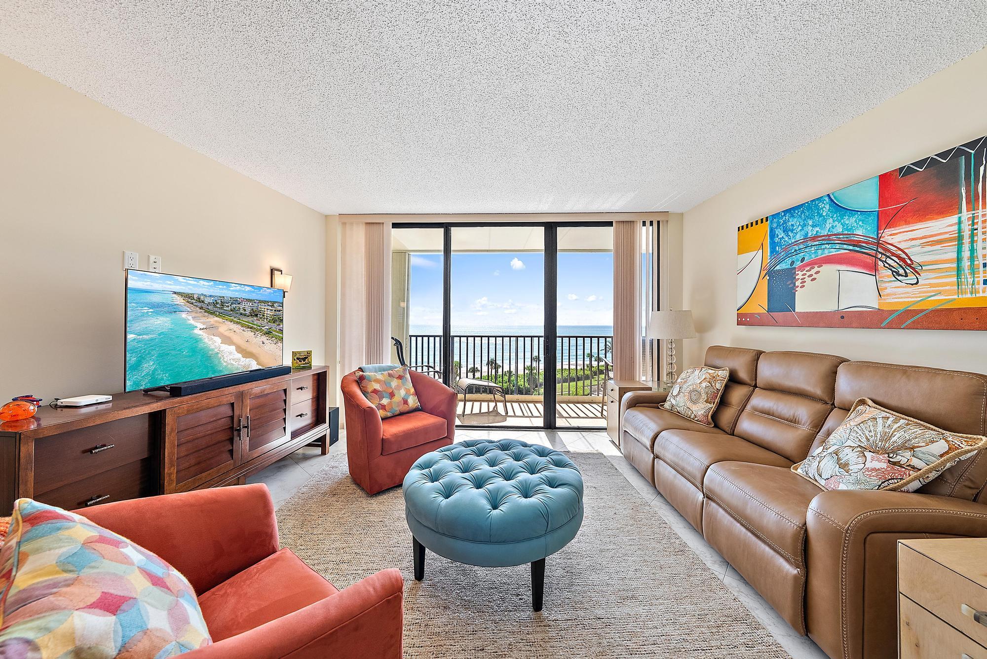 400 Ocean Trail Way, Unit 707 Jupiter, FL 33477 - Photo 5 of 34 a living room with furniture and a large window