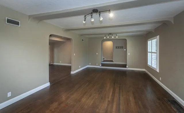 a kitchen with stainless steel appliances granite countertop a stove a refrigerator and a sink