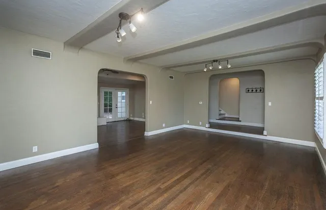 a kitchen with stainless steel appliances granite countertop a refrigerator stove and sink