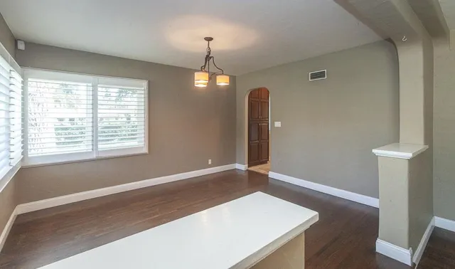 a view of a kitchen with a sink and a fireplace