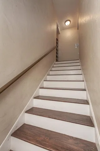 a bathroom with a tub sink and window