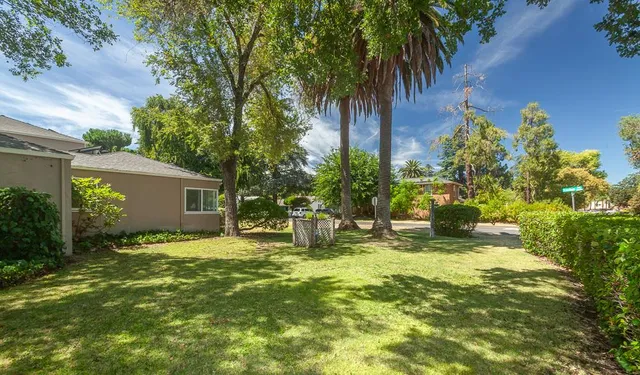 an empty room with wooden floor and entrance